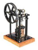 A well-engineered model of an over-type vertical live steam mill engine