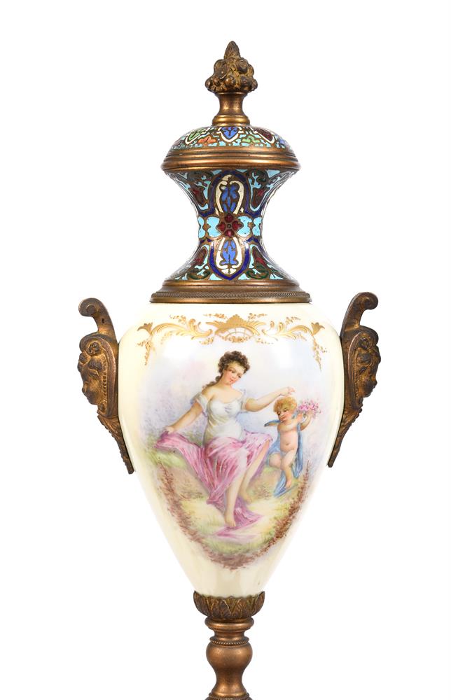 A FINE FRENCH CHAMPLEVE ENAMELLED AND PAINTED PORCELAIN FOUR-GLASS MANTEL...