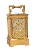 A FRENCH GILT ANGLAISE RICHE CASED REPEATING CARRIAGE CLOCK WITH FINE ENGRAVED FRETWORK PANELS