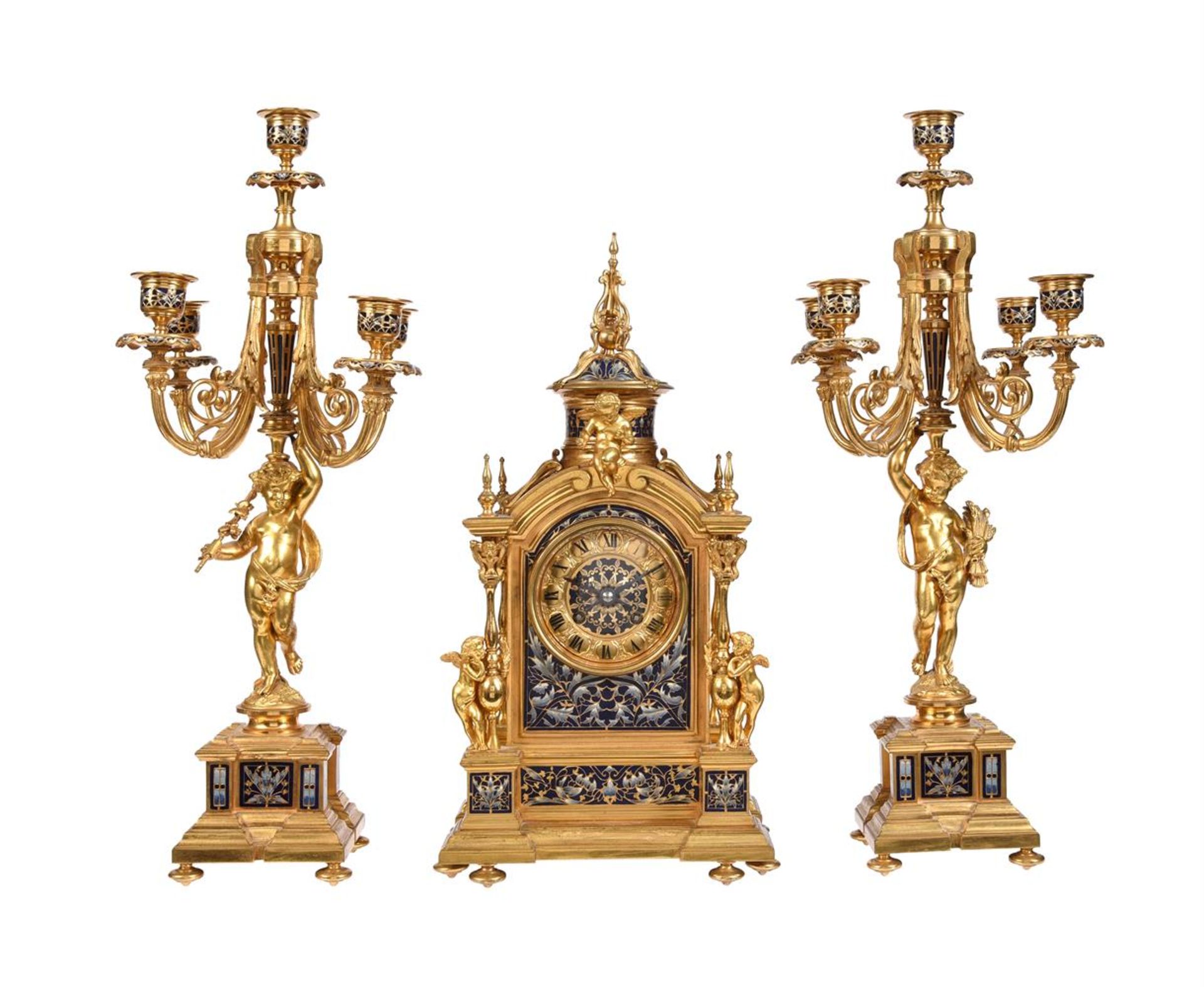 A FINE FRENCH BELLE EPOQUE GILT BRASS AND CHAMPLEVE ENAMELLED MANTEL CLOCK GARNITURE