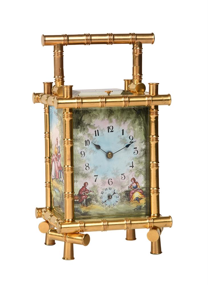 A FRENCH GILT BAMBOO CASED REPEATING ALARM CARRIAGE CLOCK WITH PAINTED FIRED ENAMEL PANELS