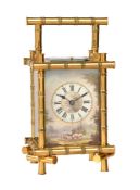 A FRENCH GILT BAMBOO CASED REPEATING CARRIAGE CLOCK WITH PAINTED PORCELAIN DIAL