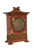 AN EDWARDIAN SCARLET JAPANNED CHINOISERIE DECORATED MANTEL TIMEPIECE