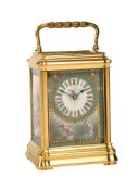 A GILT BRASS GORGE CASED REPEATING CARRIAGE CLOCK WITH FINE PAINTED PORCELAIN PANELS