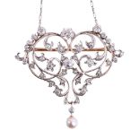 AN ART NOUVEAU DIAMOND AND PEARL BROOCH/PENDANT CIRCA 1910