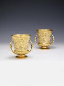A PAIR OF LATE GEORGE III SILVER GILT TWIN HANDLED CUPS, PAUL STORR