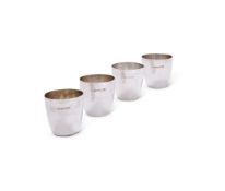 A SET OF FOUR HAMMERED SILVER SMALL BEAKERS, WILLIAM WELSTEAD LTD