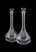 BACCARAT, A PAIR OF CLEAR GLASS TEAR SHAPED DECANTERS AND STOPPERS