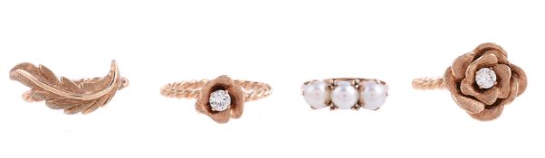 A TRIO OF INTERLOCKING FLORAL RINGS