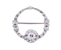 A DIAMOND CIRCLET BROOCH