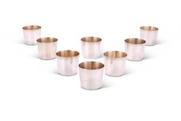 A SET OF EIGHT GREEK SILVER COLOURED SMALL BEAKERS, THALEIA