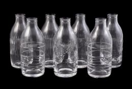 A GROUP OF SEVEN CLEAR GLASS CARAFES OR VASES, SAMANTHA SWEET