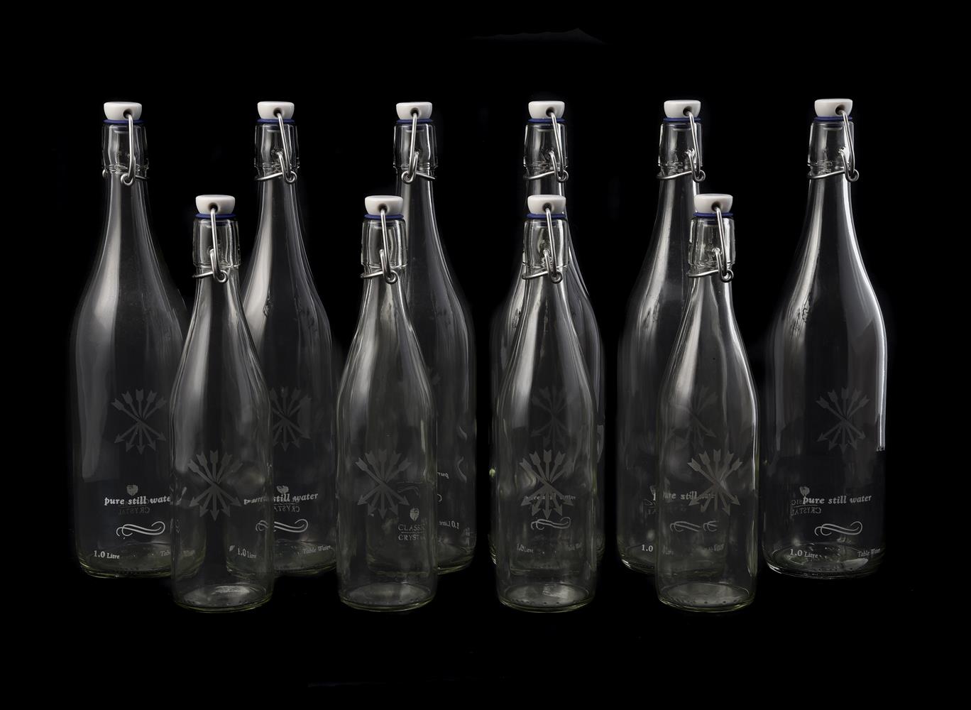 SIX LARGE GLASS WATER BOTTLES OF KILNER TYPE