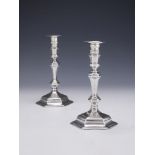 A PAIR OF GEORGE I CAST SILVER HEXAGONAL CANDLESTICKS, JOSEPH STEWARD I