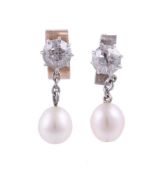 A PAIR OF DIAMOND AND PEARL EARRINGS