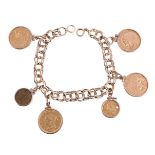 A GOLD COLOURED BRACELET SUSPENDING VARIOUS AMERICAN GOLD COLOURED COINS