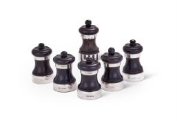 Y SIX SILVER MOUNTED EBONY PEPPER MILLS, ASPREY PLC