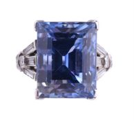 AN ART DECO SAPPHIRE AND DIAMOND DRESS RING CIRCA 1930The step cut sapphire estimated to weigh 13.