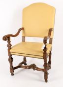 A Continental carved walnut and leather upholstered armchair