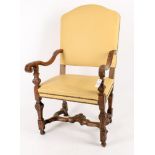 A Continental carved walnut and leather upholstered armchair