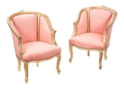 A pair of giltwood and upholstered bergère armchairs