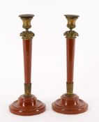 A pair of 19th century Griotte marble candlesticks