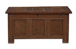 A panelled oak chest or coffer