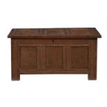 A panelled oak chest or coffer