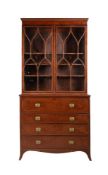 A George III mahogany, satinwood banded and box strung secretaire bookcase,