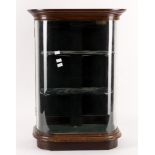 A late 19th/early 20th century mahogany and glazed bowfront table top shop display cabinet