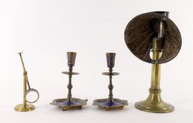 A pair of brass and niello Indo-Persian candlesticks