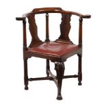 A George III mahogany corner armchair