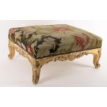 A giltwood and gesso footstool in Louis XV style