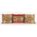 A set of three late Victorian needlework upholstered cushions