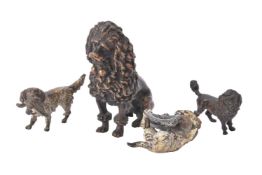A group of bronze figures of dogs