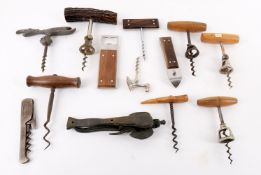 A large quantity of assorted corkscrews to include a Lund Patent two part lever corkscrew