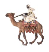 A Franz Xavier Bergmann (1861-1936) cold painted bronze group of an Arab on a camel