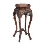 A Chinese carved hardwood and marble inset jardinière stand