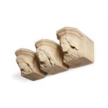 A SET OF THREE CARVED SANDSTONE CORBEL HEADS, PROBABLY LATE 19TH CENTURY