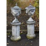 A PAIR OF GEORGE III STYLE LEAD LIDDED URNS, PROBABLY MID/EARLY 20TH CENTURY