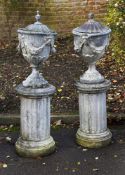 A PAIR OF GEORGE III STYLE LEAD LIDDED URNS, PROBABLY MID/EARLY 20TH CENTURY