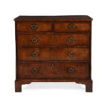 A GEORGE II FIGURED WALNUT, CROSSBANDED AND LINE INLAID CHEST OF DRAWERS, CIRCA 1740
