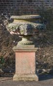 A LARGE STONE COMPOSITION TWIN HANDLED URN ON STAND, 20TH CENTURY