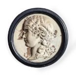 A PAINTED PLASTER ROUNDEL WITH CLASSICAL FEMALE PROFILE RELIEF, PROBABLY EARLY 19TH CENTURY