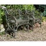 A PAIR OF CAST IRON SINGLE BENCHES, IN THE GOTHIC STYLE, MODERN