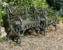 A PAIR OF CAST IRON SINGLE BENCHES, IN THE GOTHIC STYLE, MODERN