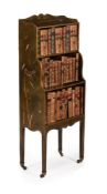A GREEN LACQUER AND GILT CHINOISERIE DECORATED 'WATERFALL' OPEN BOOKCASE, EARLY 20TH CENTURY