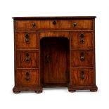 A GEORGE I WALNUT KNEEHOLE DESK, CIRCA 1720