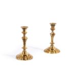 A PAIR OF ITALIAN ORMOLU CANDLESTICKS, EARLY 18TH CENTURY