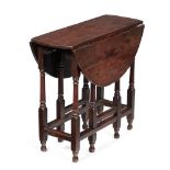 AN UNUSUAL CHARLES II SOLID FRUITWOOD OVAL DROP LEAF TABLE, CIRCA 1680